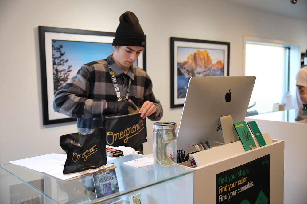 Budtender fulfilling a cannabis delivery order